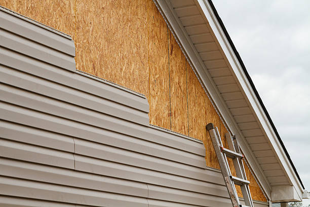 Professional Storm Damage Siding Repair technician working in Port Washington, NY